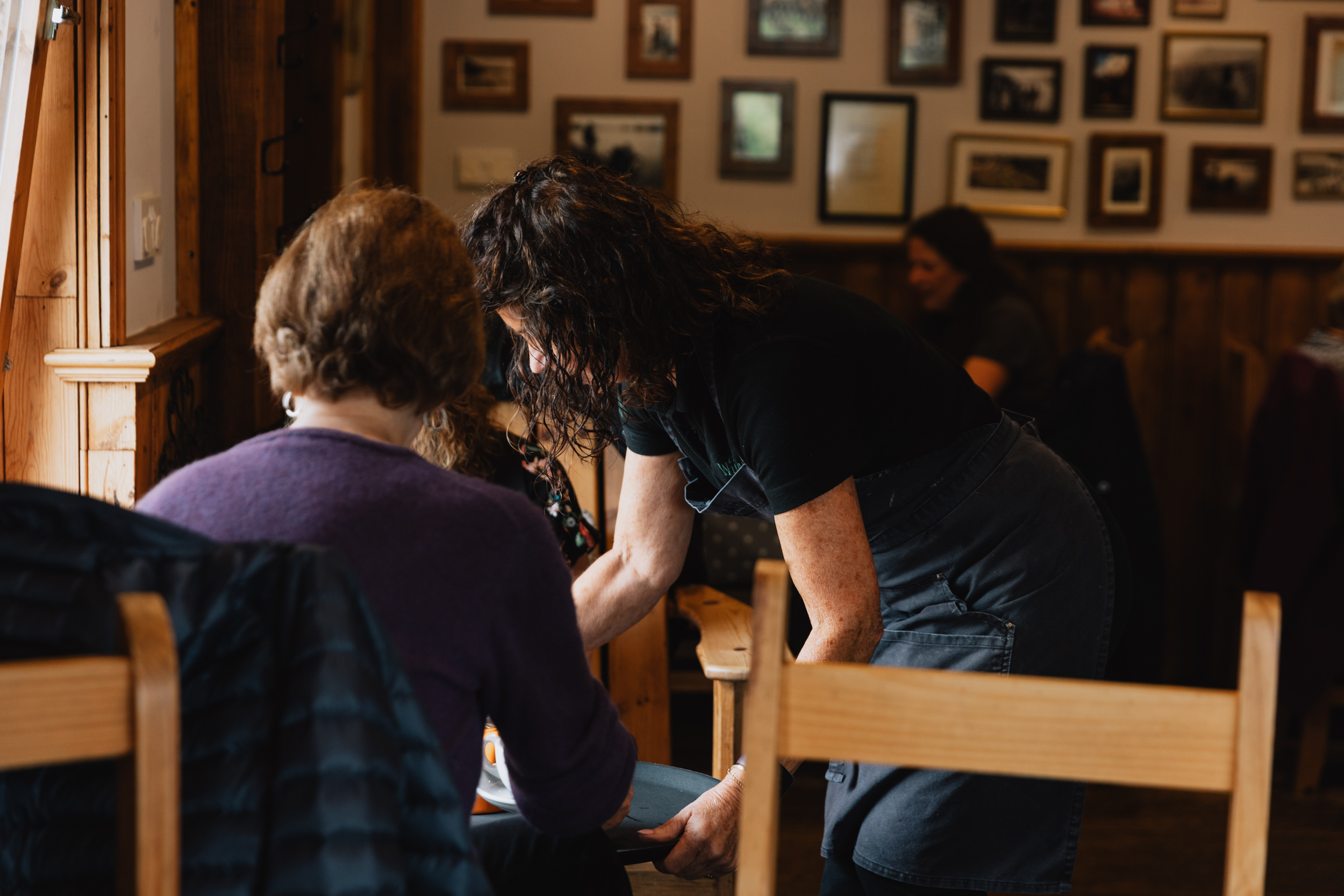 Staff serving guests in the dining room at Willowgate Café, available for private hire near Perth